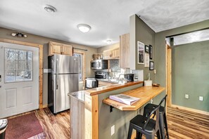 Breakfast bar overlooking the beautiful kitchen with all new appliances.