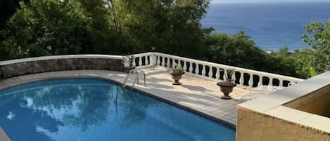 The pool overlooks the sparkling Caribbean Sea