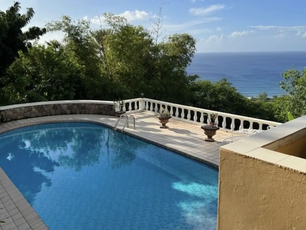 The pool overlooks the sparkling Caribbean Sea