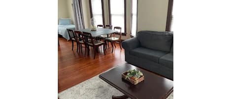 Living room, dining area, and second bedroom.