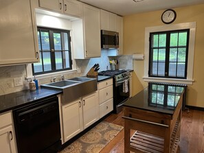 Whip up a wonderful dinner for your group in this immaculate kitchen with gas stove.