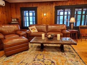 Leather seating in the living room overlooking the lake.