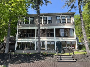 The Adirondack Waterfront Lodge facing the water, look at all those windows! Enjoy views of the lake from almost every room in the house.