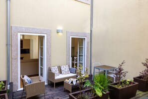 The charming private patio is located in the middle of the refurbished building.
