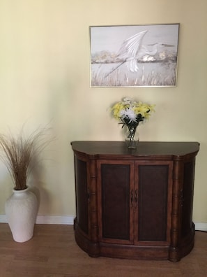 Front entrance view of Living Room with bombe chest.
