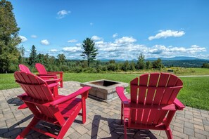 Patio with firepit, 4 Adirondack chairs, and stunning views!