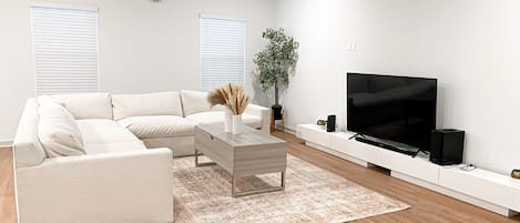 Living room with 65" TV. Netflix and Prime available 