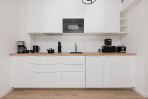 The fully equipped kitchenette includes everything you need for a home-cooked meal.
