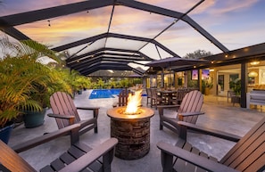 Enjoy tranquil evenings beside the flickering flames, where warmth meets luxury beneath the stars