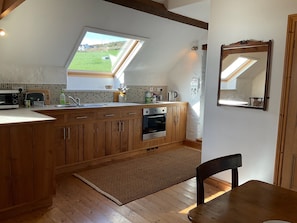 fully equipped kitchen with hob, oven fridge/freezer, microwave, toaster, kettle