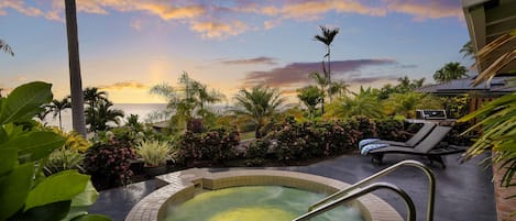 Enjoy the hot tub with the sunset on the horizon