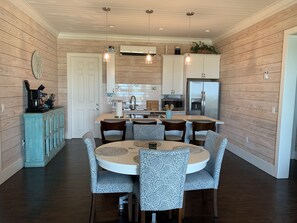 View from living room in to dining kitchen . King rooms on the right Queens left