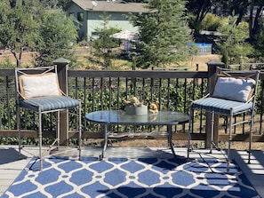 Seating area for two person spa on private back deck of Ranch House