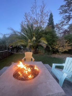 Gas fire pit just steps away from your room, above and overlooking the pool area