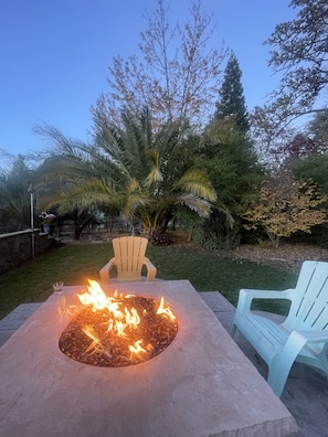 Gas fire pit just steps away from your room, above and overlooking the pool area