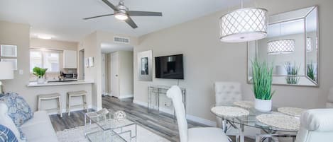 Open concept floor plan with upscale furnishings ideal for entertaining.