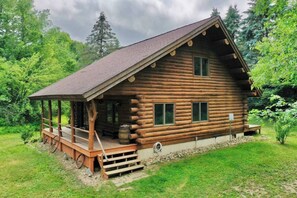 Located on 20 acres of countryside, this log cabin and the surrounding property provide family and friend entertainment for all ages. 