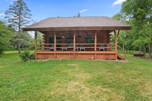 Watch sunrise to sunset from this end to end rustic styled porch.