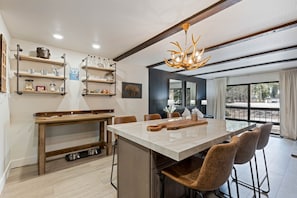 "Room","Indoors","Kitchen Island","Lamp","Living Room"