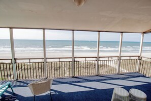 You'll be able to enjoy the sea breeze and wavey views with the whole group on this wide balcony.