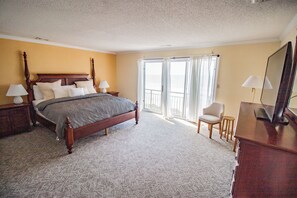 The Main bedroom fit for a king and queen with sliding doors to the balcony.