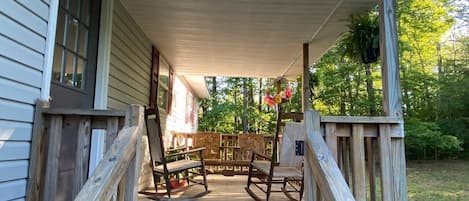 This is the coziest front porch overlooking a big front yard and woods.  You will be so private you can sit outside in your jammies and drink coffee and maybe catch sight of a deer. 