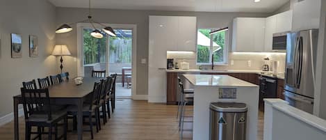 Open concept kitchen and dining room giving access to your private backyard