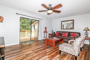 Living room with back door to  deck 