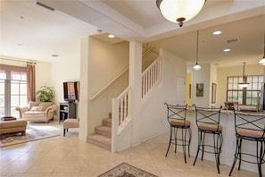 Open floorplan to kitchen.