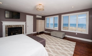 You'll love the fireplace and flat-screen TV in the master bedroom!