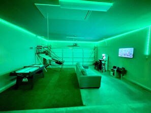 Garage game room with LED accent lighting and plenty of games, including a Wii!