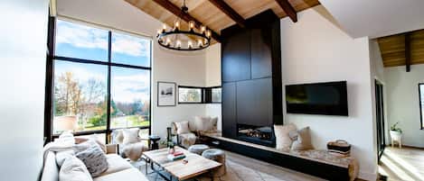 Fabulous floor to ceiling windows grace the living room