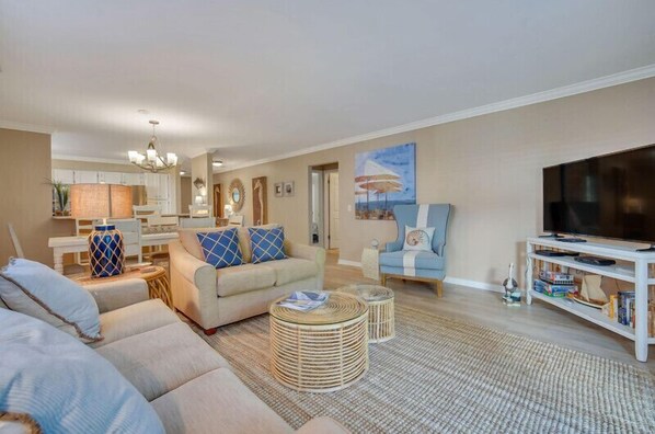 Living room, open to dining and kitchen.