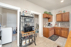 Kitchen with Microwave and Toaster Oven. Free Laundry Room on the Left