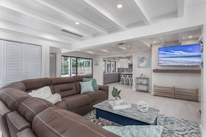 Large corner sofa situated around a new Smart Google TV for streaming your favorite apps