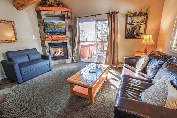 Living Room with Gas Fireplace and Sliders to Deck