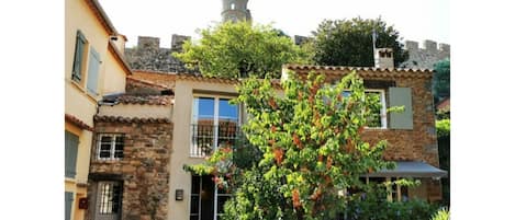 Historical village house directly under the castle in the center of the village