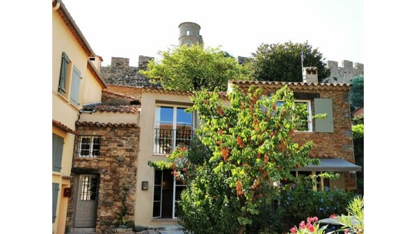 Historical village house directly under the castle in the center of the village