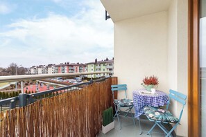 Balcony with garden furniture.