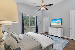 Bright master bedroom with large windows and ensuite