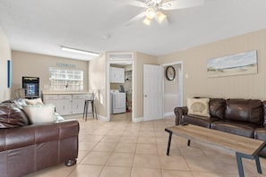 Downstairs living room with sleeper sofa and arcade games