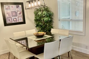 Glass top beech timing dining table seats up to 8.