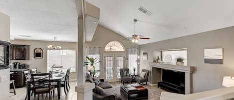 Front Entry open floorplan with sunken Living room and Dining area.