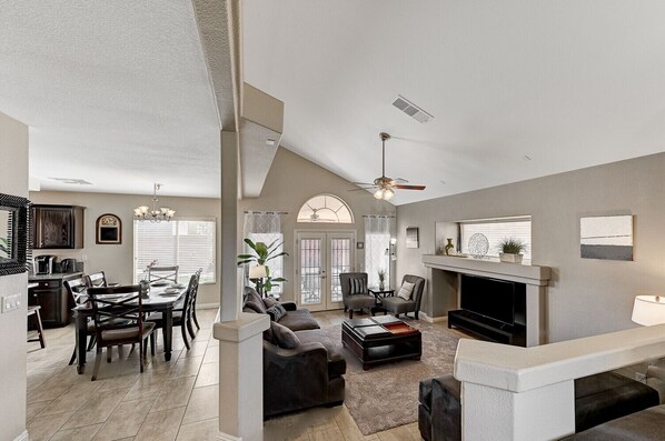 Front Entry open floorplan with sunken Living room and Dining area.