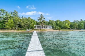 Private beach and dock leading to house