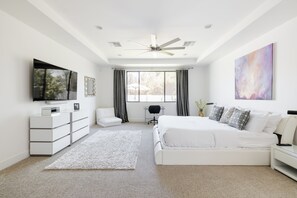 Primary Bedroom with King Bed, Queen Bed, TV, and Bathroom