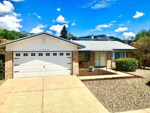 Front of house with 2 car garage and entry door. Parking in garage or driveway 