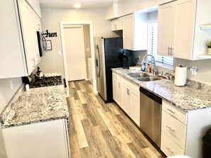 Kitchen with granite counters and stainless steel appliances