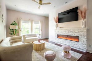 Watch your favorite shows/movies on our 65” cable TV!