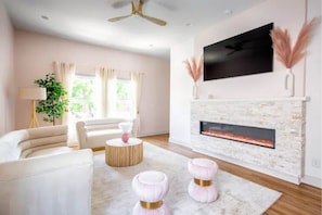 Watch your favorite shows/movies on our 65” cable TV!